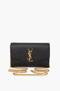 Saint Laurent uptown chain wallet in grain de poudre embossed leather