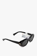 Miu Miu Black Oval MU 06ZS Sunglasses